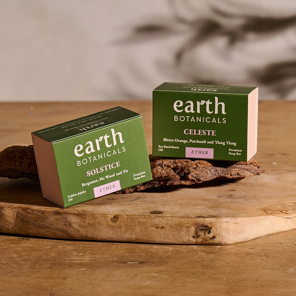 Celeste and Solstice Earth Botanicals natural soap bars in packaging on wood — Ether Collection handmade in Brighton