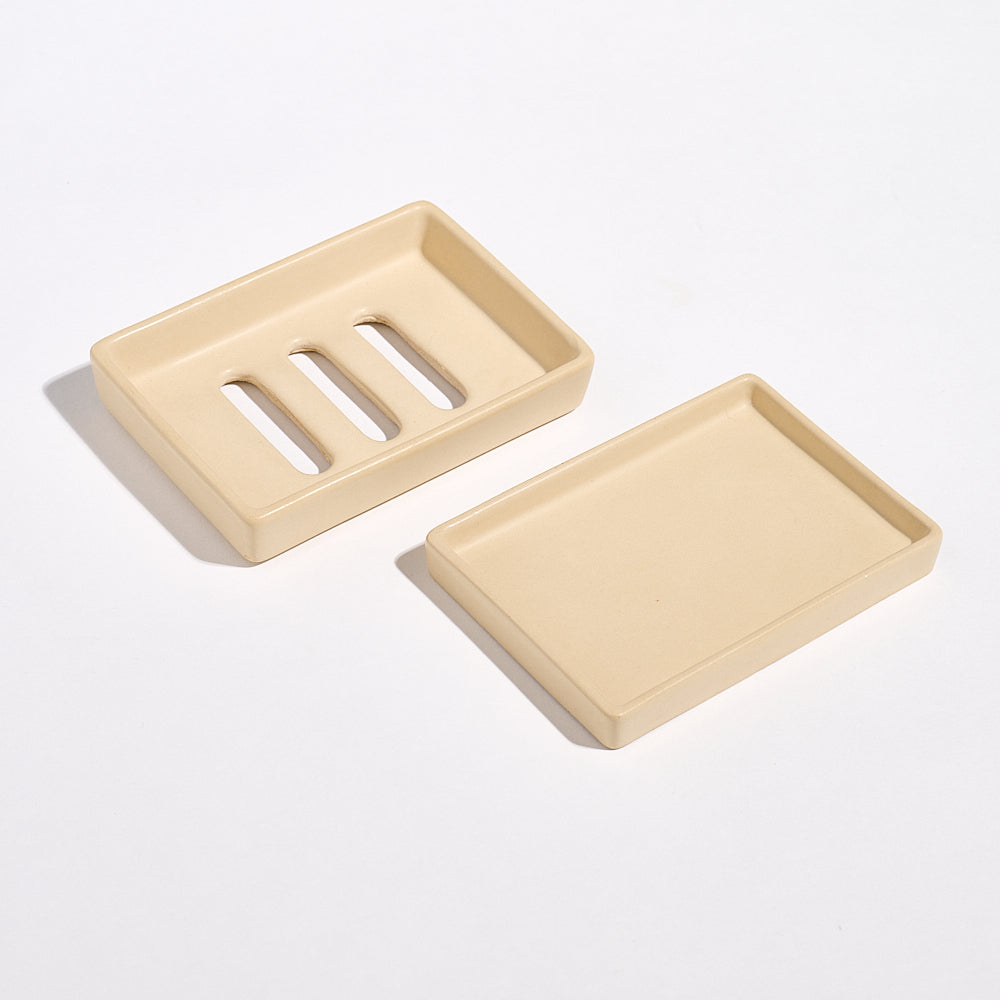 Yellow Sandstone Jesmonite soap dish with drainage holes and tray on a white background.