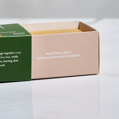 Two skincare product boxes with text on a light gray background