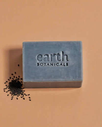 Woodnote vetiver bergamot and palmarosa natural soap bar with black cumin seeds handmade in Brighton